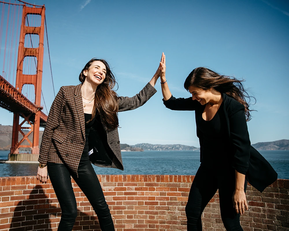 Me and Tara in front of the Golden Gate bridge, high-fiving